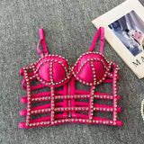 Top acolchado con cuello en V, cremallera y cuentas caladas 