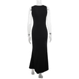 Robe longue unie à col en V profond et appliques florales 