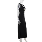 Robe longue unie à col en V profond et appliques florales 