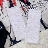 Gants chauffe-jambes à décor de croix creuse