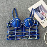 Top acolchado con cuello en V, cremallera y cuentas caladas 