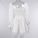 Long sleeve smocked lace up lace hem mini dress