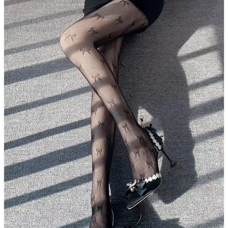 Collants résille à motif nœud papillon 