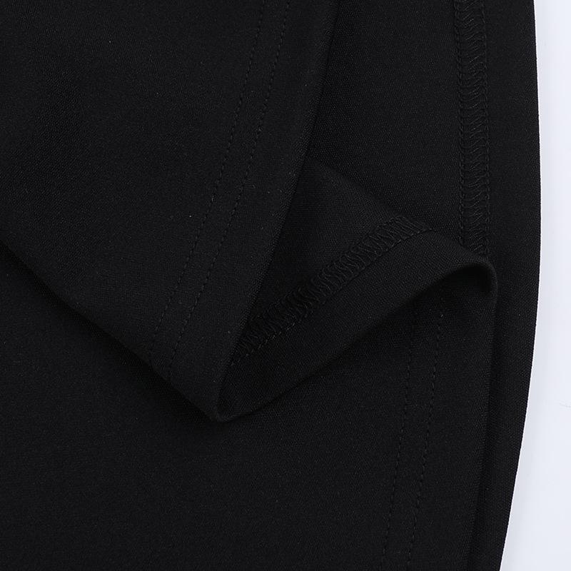 Robe longue unie à col en V profond et appliques florales 