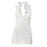 Mini-robe dos nu en tricot à nouer soi-même avec pompons 