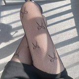 Collants résille à motif nœud papillon 