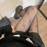 Collants résille à motif nœud papillon 