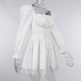 Long sleeve smocked lace up lace hem mini dress