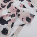 Vestido largo sin espalda y cuello alto con estampado de leopardo 
