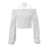Top de cuello en V con lazo y mangas largas con hombros descubiertos 