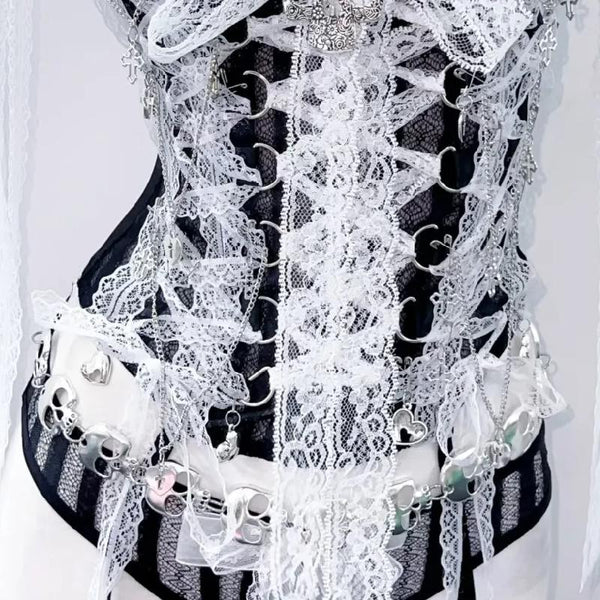 Haut à lacets avec ourlet en dentelle et appliques de crâne, col en V et nœud 