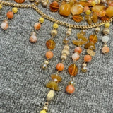 Haut camisole licou ajouré en chaîne métallique et perles 