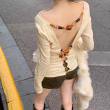 Long sleeve hollow out beaded v neck top